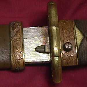 Blade and scabbard locking mechanism