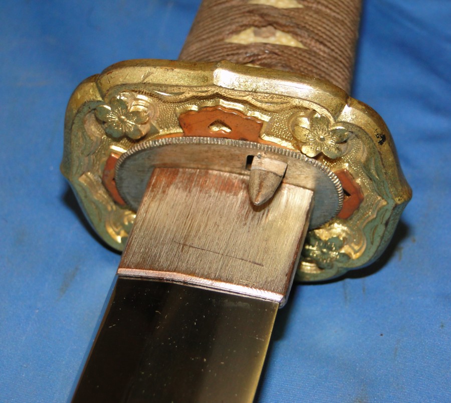 Blade and scabbard locking mechanism